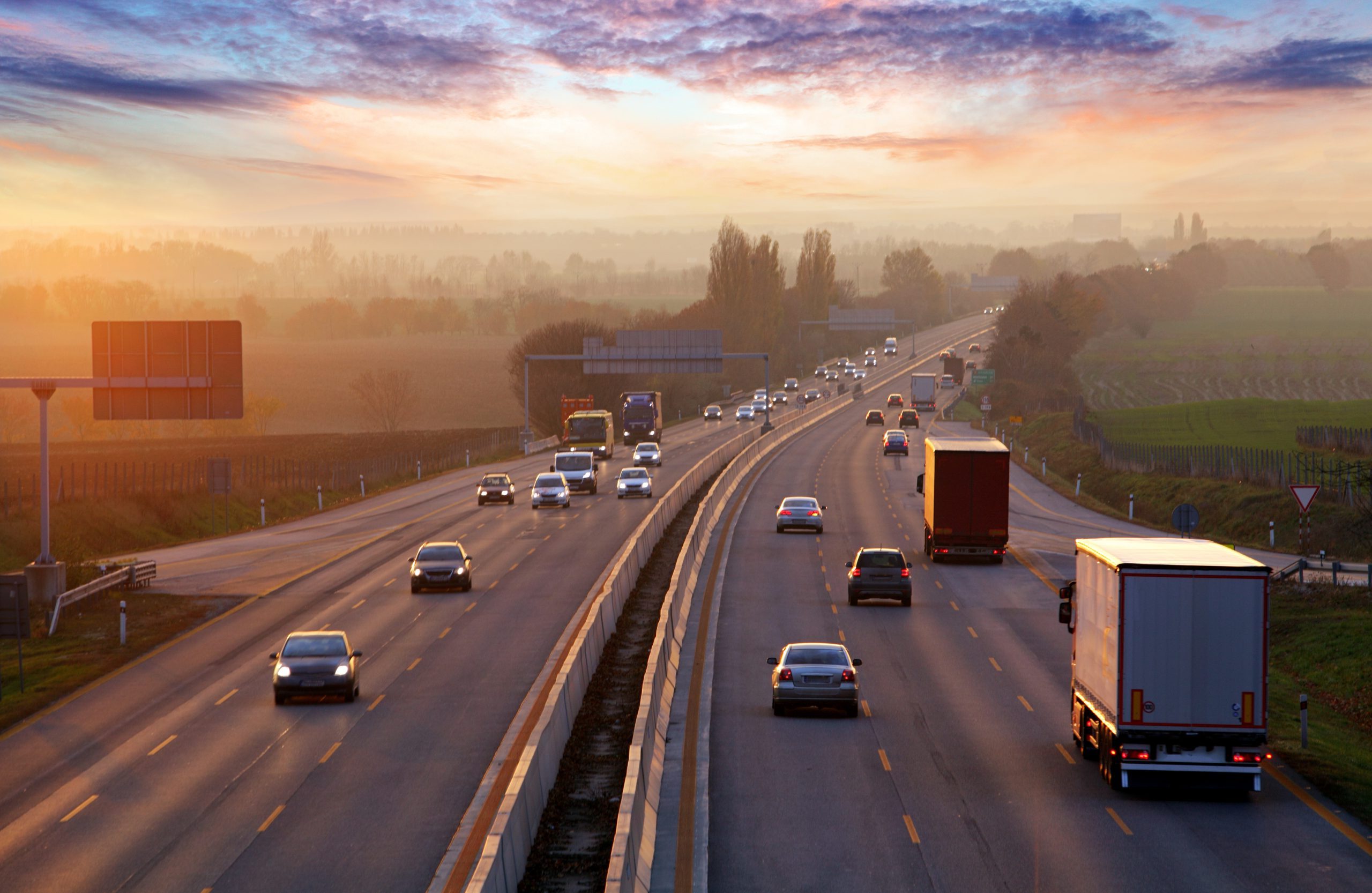 Traffic on highway with cars.