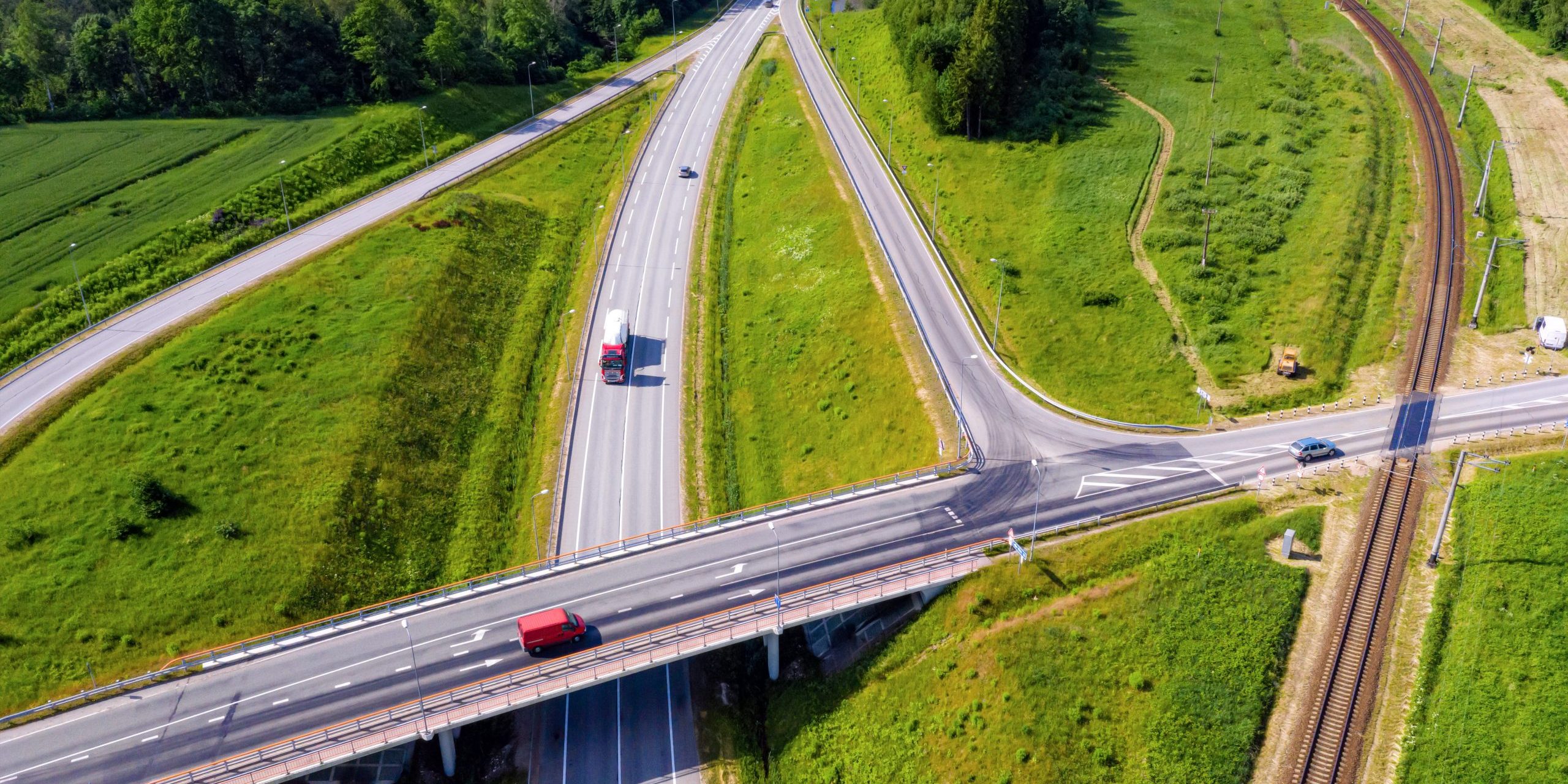 aerial top view of the multi-level intersection of the Latvian national highway A1 (part of the European route E67 - Via Baltica) near Skulte, Latvia